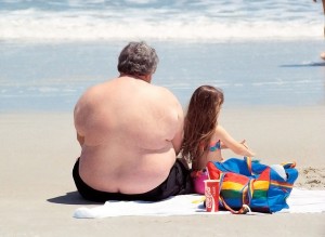 Overweight beach man
